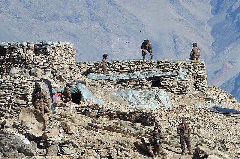 In this undated handout photograph released by the Indian Army on February  16, 2021 shows People Liberation Army (PLA) soldiers during military disengagement along the Line of Actual Control (LAC) at the India-China border in Ladakh. / AFP / INDIAN MINISTRY OF DEFENCE / - / ----EDITORS NOTE---- RESTRICTED TO EDITORIAL USE - MANDATORY CREDIT "AFP PHOTO / Indian Army" - NO MARKETING NO ADVERTISING CAMPAIGNS - DISTRIBUTED AS A SERVICE TO CLIENTS----------
