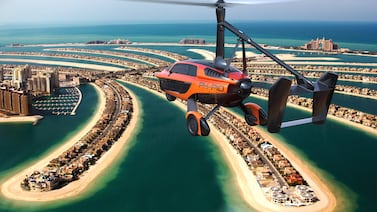 A rendering of the Liberty flying car travelling above The Palm Jumeirah. The vehicle has a flight range of between 400km and 500km. Photo: PAL-V