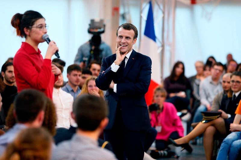 French President Emmanuel Macron listens during a meeting with youths as part of the "great national debate" in Etang-sur-Arroux, central France. AFP