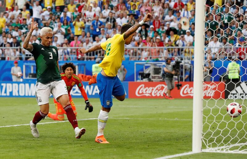 Brazil's Roberto Firmino scores their second goal. Carlos Garcia Rawlins / Reuters