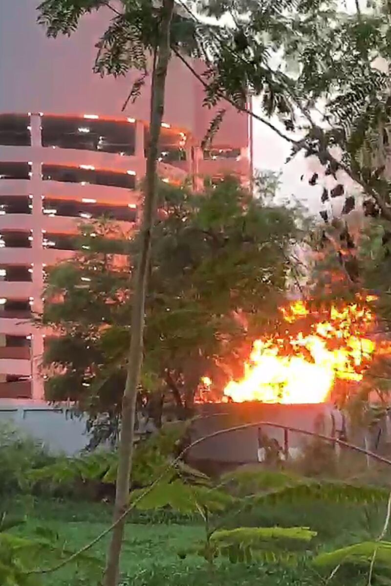 A screenshot from a video released by the Thai Royal Police shows a fire in the compound of the Terminal 21 shopping mall. AFP / Thai Royal Police