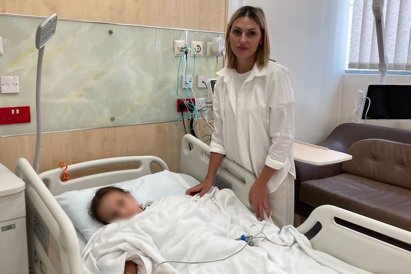 Ceban Oxana with her daughter, who received an innovative spinal implant at the Neuro Spinal Hospital in Dubai Science Park. Photo: Ceban Oxana