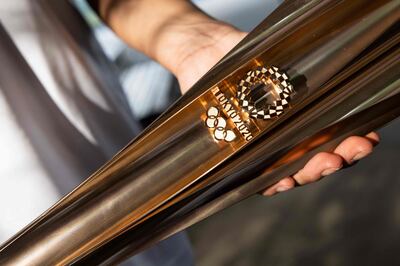 The rose-gold Olympic torches are made using recycled aluminium. AFP