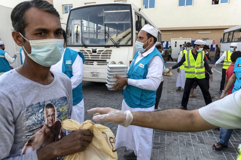 The Sri Lanka community along with the help of the Watani Al Emirate Foundation collectvely distributed two thousand / 2000 Iftar meals to workers in the Sonapur area of Dubai to mark International Workers Day on May 1st, 2021. 
Antonie Robertson / The National.
Reporter: None for National