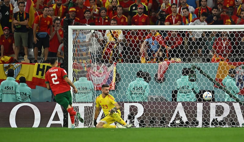 Morocco's Achraf Hakimi scores the winning penalty. Reuters