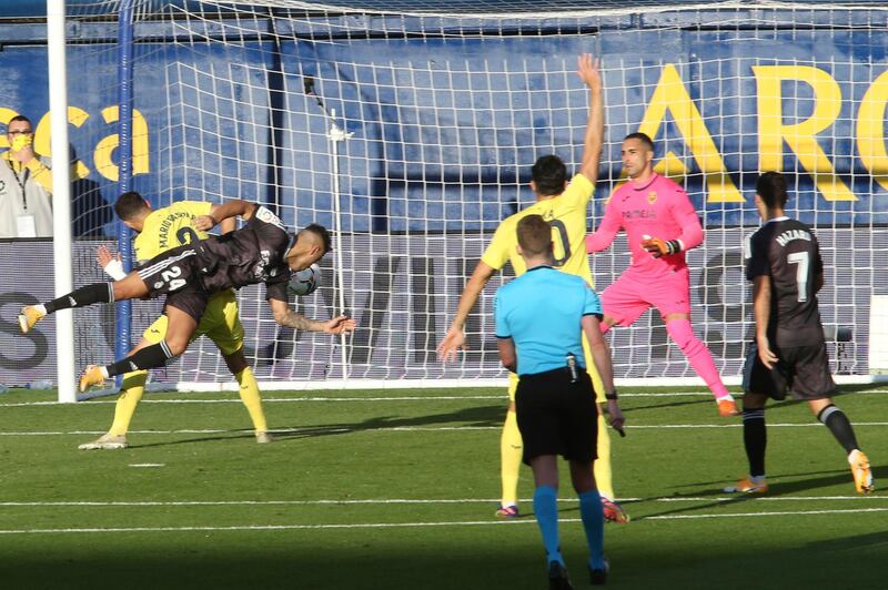 Real Madrid's Mariano Diaz, left, scores the opening goal on Saturday. AP