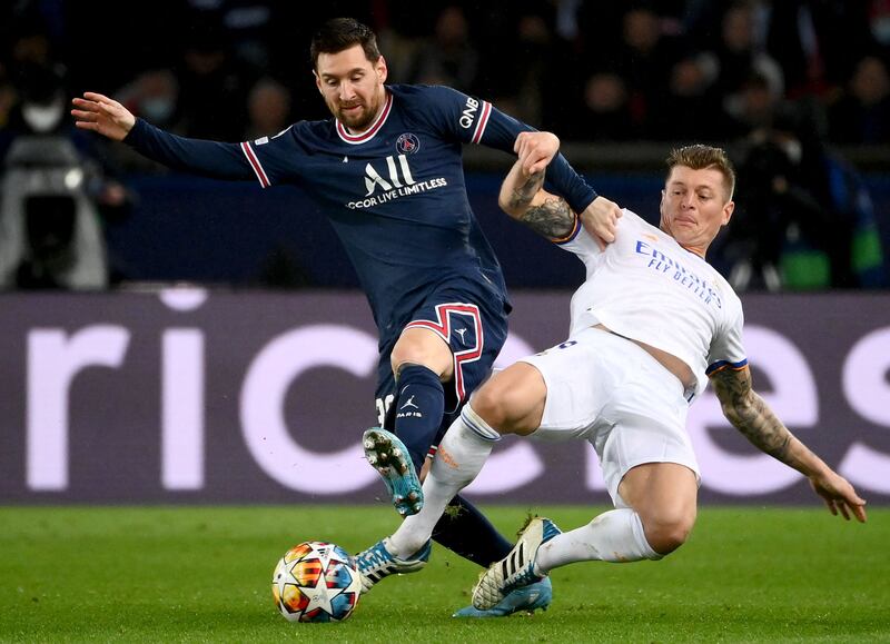 PSG's Lionel Messi fights for the ball with Real Madrid's Toni Kroos. AFP