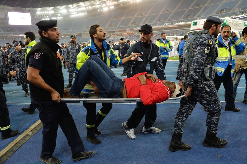 Medical staff treat injured fans after a glass barrier broke at the end of the Gulf Cup of Nations soccer Final match between Oman and UAE at Jaber Al-Ahmad International Stadium, Kuwait City, Kuwait, 05 January 2018. Noufal Ibrahim / EPA