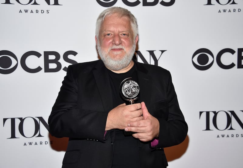 Simon Russell Beale poses in the press room with the award for best leading actor in a play for 'The Lehman Trilogy'. AP