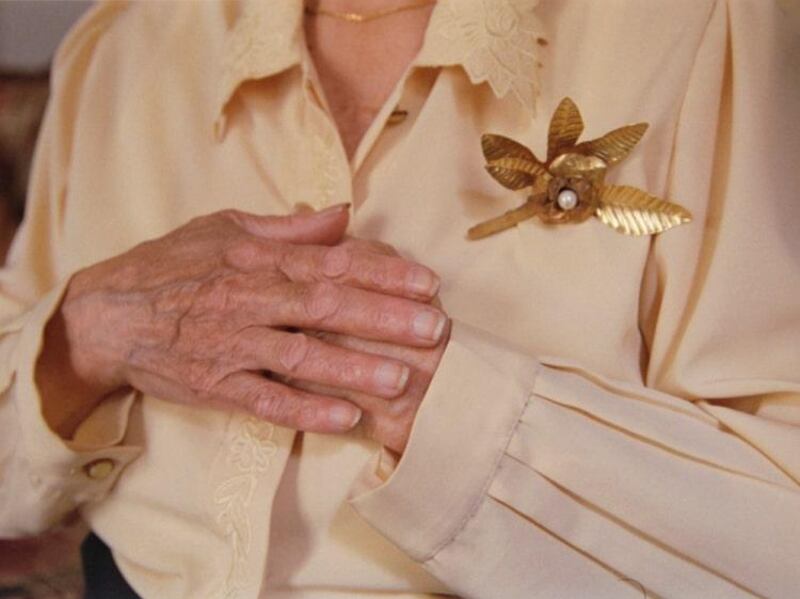 A woman wearing one of the brooches created for Beit El Baraka by Lebanese designer Krikor Jabotian.