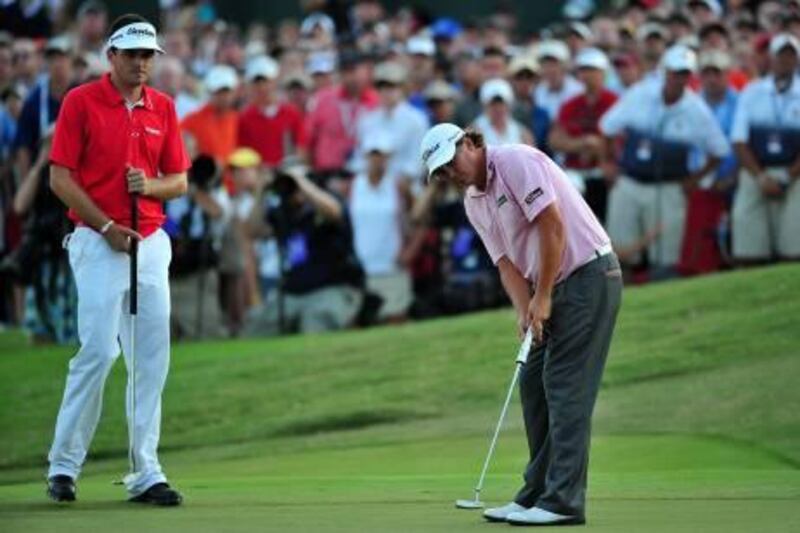 JOHNS CREEK, GA - AUGUST 14: Jason Dufner watches his birdie putt on the third playoff hole as Keegan Bradley looks on during the final round of the 93rd PGA Championship at the Atlanta Athletic Club on August 14, 2011 in Johns Creek, Georgia.   Stuart Franklin/Getty Images/AFP== FOR NEWSPAPERS, INTERNET, TELCOS & TELEVISION USE ONLY ==
 *** Local Caption ***  613153-01-09.jpg
