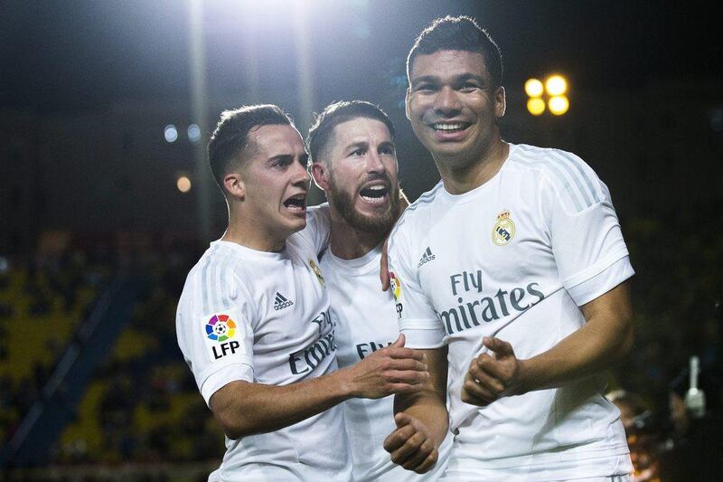 Carlos Casemiro (R) of Real Madrid CF celebrates scoring their second goal with teammates Sergio Ramos (2ndR) and Lucas Vazquez (L) during the La Liga match between UD Las Palmas and Real Madrid CF at Estadio de Gran Canaria on March 13, 2016 in Las Palmas, Spain. (Photo by Gonzalo Arroyo Moreno/Getty Images)