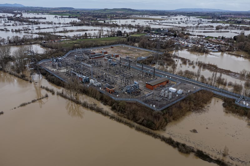 Floodwater surrounds an electricity grid substation in Gloucester. PA