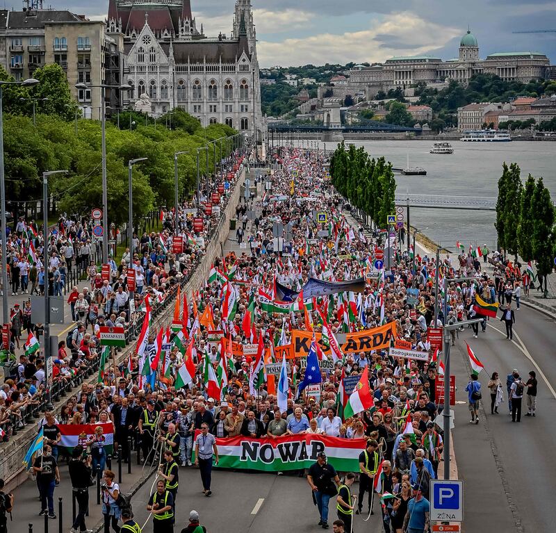 Sympathisers and members of Hungarian parties FIDESZ and KDNP march in Budapest, calling for peace in Ukraine. AFP