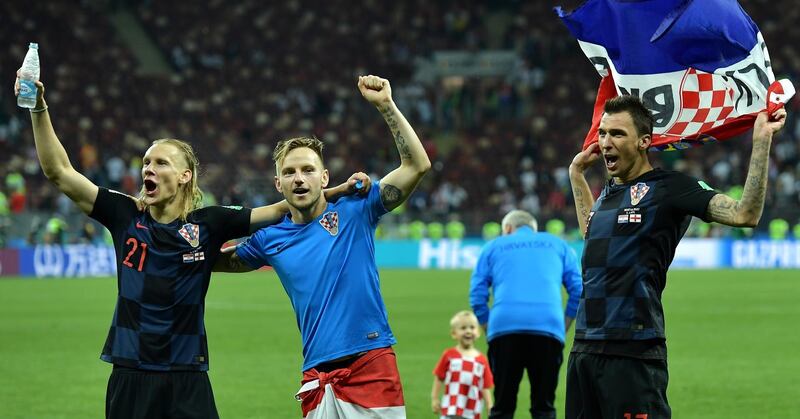 epa06882161 (L-R) Domagoj Vida, Ivan Rakitic  and Mario Mandzukic of Croatia celebrate winning the FIFA World Cup 2018 semi final soccer match between Croatia and England in Moscow, Russia, 11 July 2018.

(RESTRICTIONS APPLY: Editorial Use Only, not used in association with any commercial entity - Images must not be used in any form of alert service or push service of any kind including via mobile alert services, downloads to mobile devices or MMS messaging - Images must appear as still images and must not emulate match action video footage - No alteration is made to, and no text or image is superimposed over, any published image which: (a) intentionally obscures or removes a sponsor identification image; or (b) adds or overlays the commercial identification of any third party which is not officially associated with the FIFA World Cup)  EPA/PETER POWELL   EDITORIAL USE ONLY