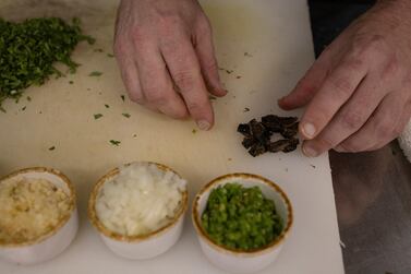 Chef Tobias Padovano prepares cicada tacos at Cocina on Market restaurant in Leesburg, Virginia. Reuters