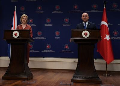 Mevlut Cavusoglu and Liz Truss speak to the media after holding talks. AP