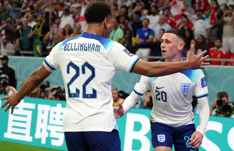 Phil Foden celebrates scoring the second goal with Jude Bellingham. PA