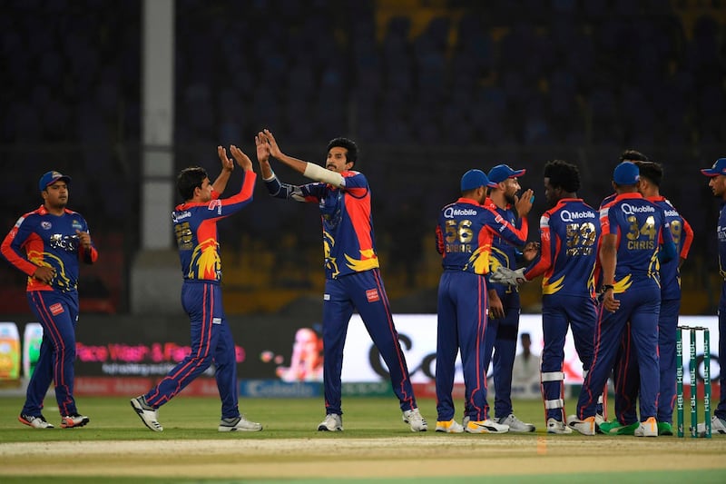 Karachi Kings Umaid Asif (C) celebrates the wicket of Rizwan Hussain during the T20 cricket match between Karachi Kings and Islamabad United at the National Cricket Stadium in Karachi on March 14, 2020.  / AFP / Asif HASSAN
