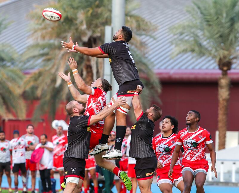 James Kora of Bahrain gets lifted for the ball during the West Asia Premiership game against Dubai Tigers at Dubai Sports City, Dubai, on January 7, 2023. All photos Victor Besa / The National