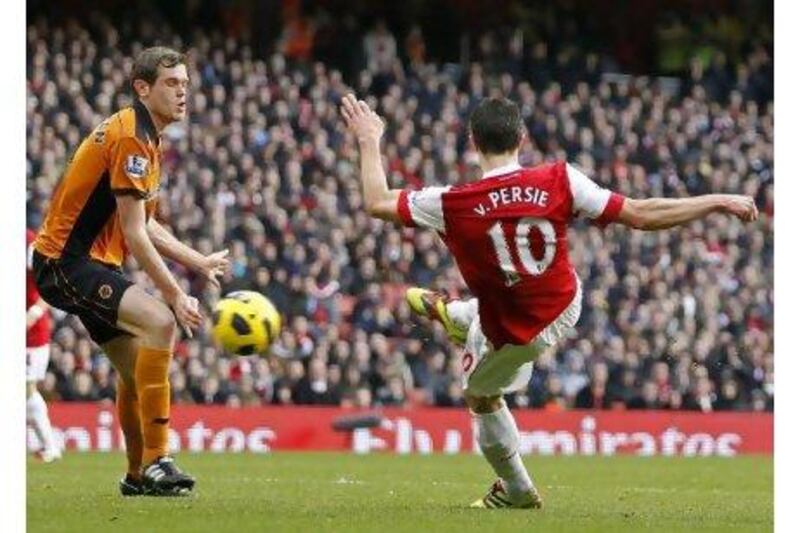 Robin van Persie scores his first goal of the game in the 2-0 victory against the Wolves with a right-foot volley after 16 minutes.