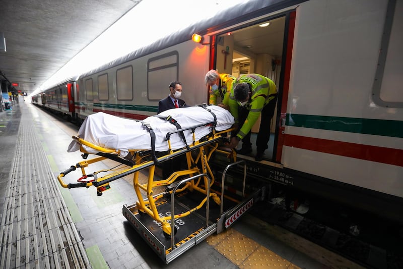 Health workers transport a training dummy on to an intensive care unit train, operated by Trenitalia SpA, during a media visit at Termini railway station in Rome, Italy. Bloomberg