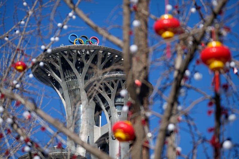 Lantern decorations are hung on trees on the Olympic Green near the Olympic Tower. AP