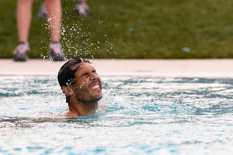 Rafael Nadal jumps in a pool after winning the ATP Barcelona Open. AFP