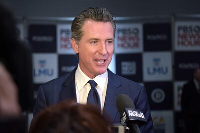 (FILES) In this file photo taken on December 19, 2019 California Governor Gavin Newsom speaks to the press in the spin room after the sixth Democratic primary debate of the 2020 presidential campaign season co-hosted by PBS NewsHour & Politico at Loyola Marymount University in Los Angeles, California. California Gov. Gavin Newsom (D) issued a statewide stay-at-home order starting March 19, 2020 evening. “This is a moment we need to make tough decisions," Newsom said at an online news conference. It is the strongest statewide restriction yet aimed at stemming the spread of the coronavirus. The announcement follows similar orders issued in the past few days across the San Francisco Bay area and Los Angeles.  / AFP / Agustin PAULLIER
