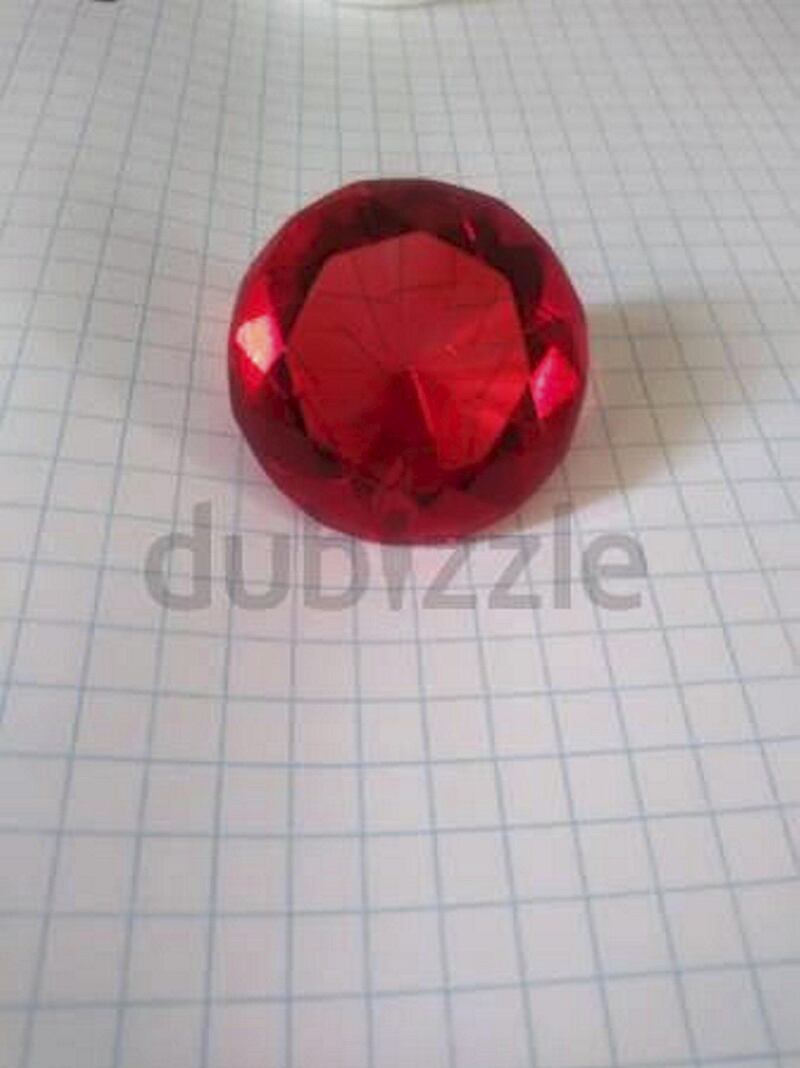 Aladdin Production Ruby. Description: "Piece is huge - measures 2x2x2 inches. From the Sotheby's auction in 199.  Ready to hang on the wall! Or enjoy it as a huge piece of jewelry". Verified by dubizzle? No. Courtesy Dubizzle