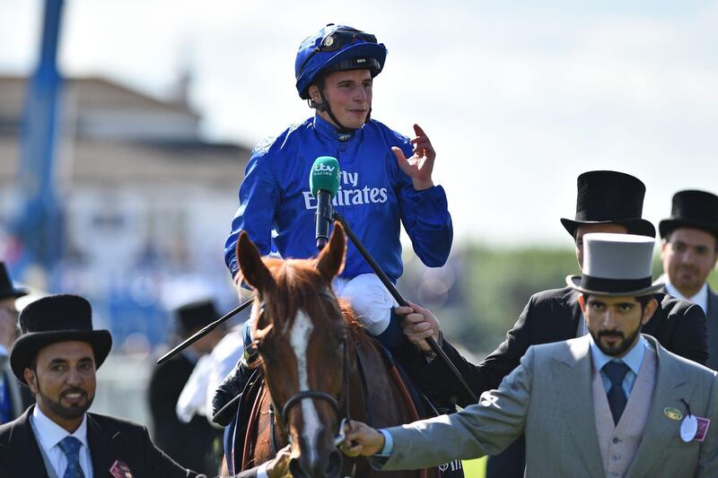 Jockey William Buick gestures as he returns to the winner's enclosure on Masar after his victory for breeder Godolphin in the Derby on the second day of the Epsom Derby Festival in Surrey, southern England on June 2, 2018.   / AFP / Glyn KIRK
