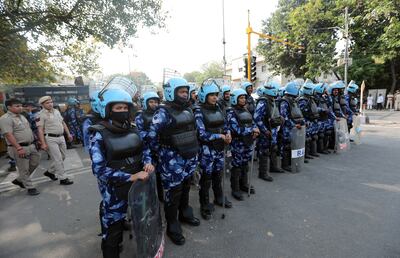 Security personnel stand guard outside the court in Delhi where Arvind Kejriwal appeared on Friday. EPA