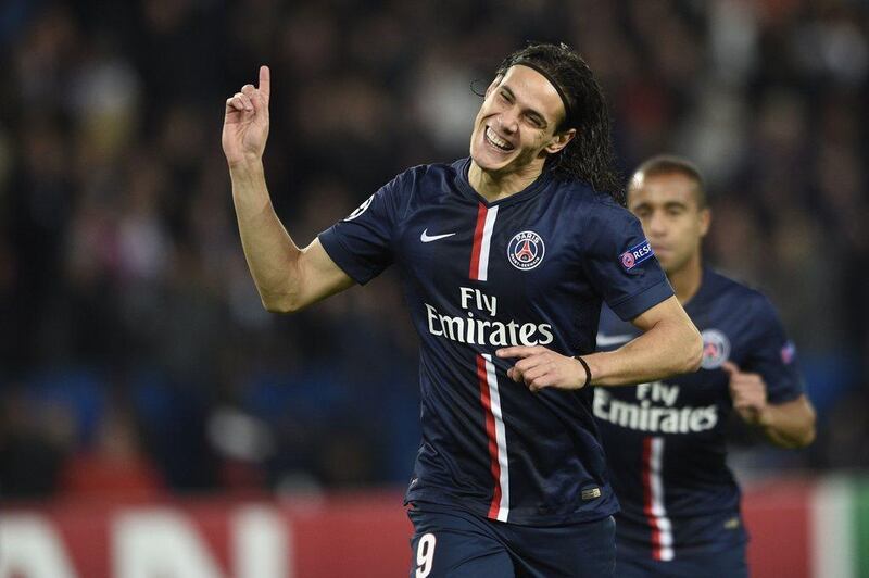 Paris Saint-Germain's Edinson Cavani celebrates after scoring a goal in PSG's Champions League win over Apoel Nicosia on Wednesday in Paris. Martin Bureau / AFP / November 5, 2014  