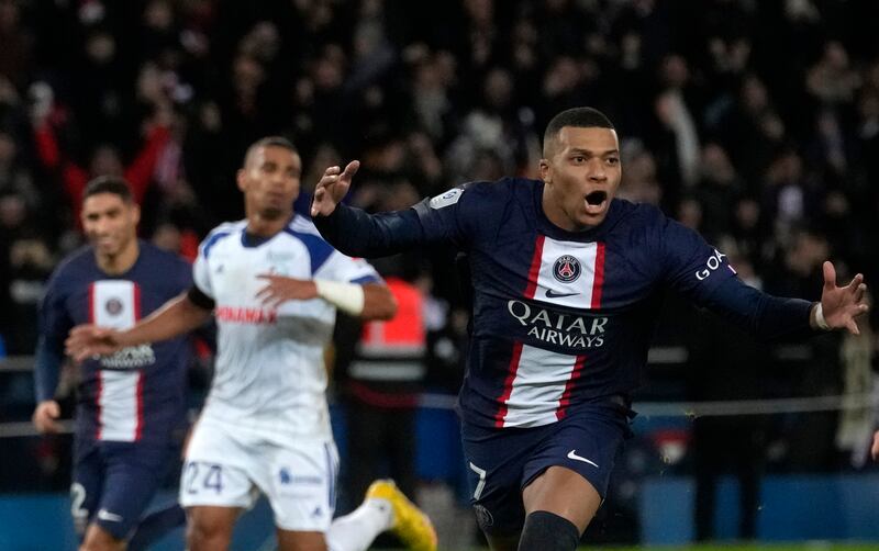 Kylian Mbappe celebrates after scoring Paris Saint-Germain's second goal from penalty spot during the Ligue 1 match against Strasbourg at the Parc des Princes in Paris, Wednesday, December  28, 2022. AP