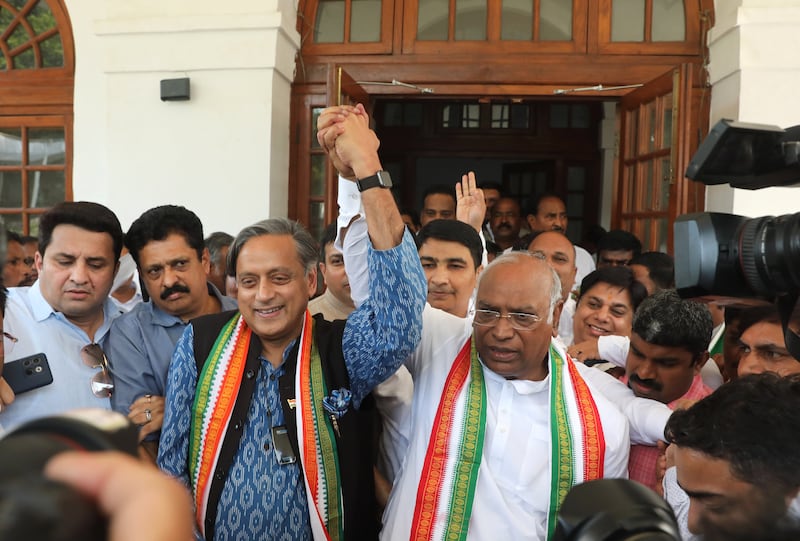 Shashi Tharoor (L) and Mallikarjun Kharge (R) celebrate after the latter won the Indian Congress Party leadership election. EPA