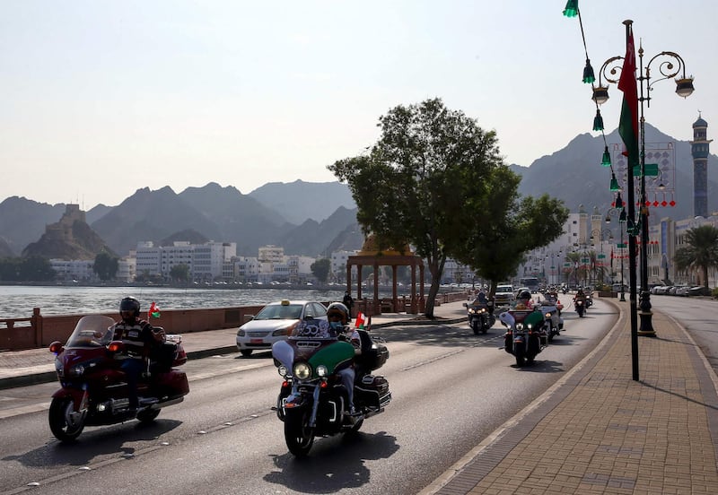 Bikers drive down a street in the Omani capital Muscat, on November 14, 2020, as part of the 50th National Day celebrations. / AFP / MOHAMMED MAHJOUB
