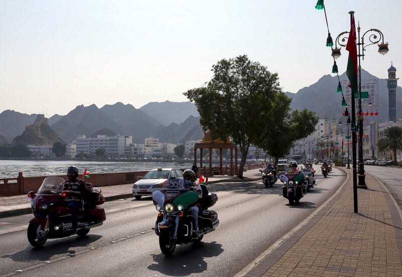 Bikers drive down a street in the Omani capital Muscat, on November 14, 2020, as part of the 50th National Day celebrations. / AFP / MOHAMMED MAHJOUB
