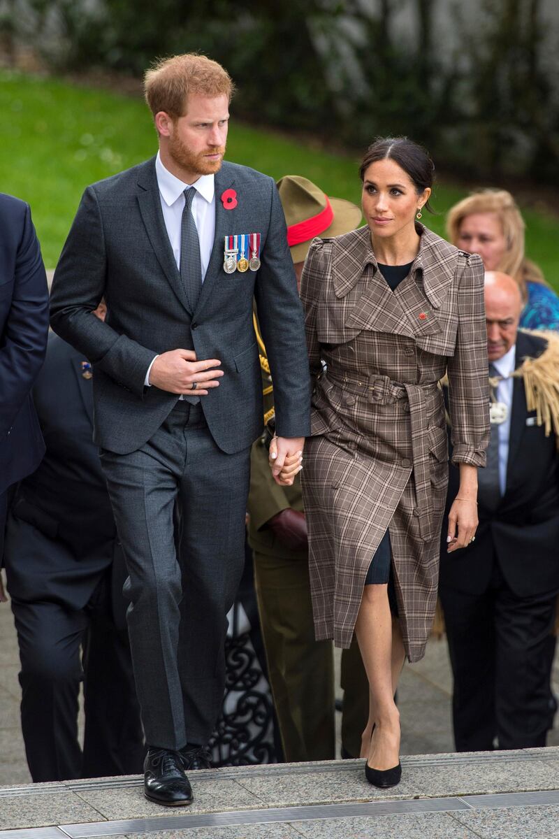 Meghan, Duchess of Sussex wears a Karen Walker coat and Asos dress at the Tomb of the Unknown Warrior at Pukeahu National War Memorial Park in Wellington, New Zealand, on October 28, 2018. AP