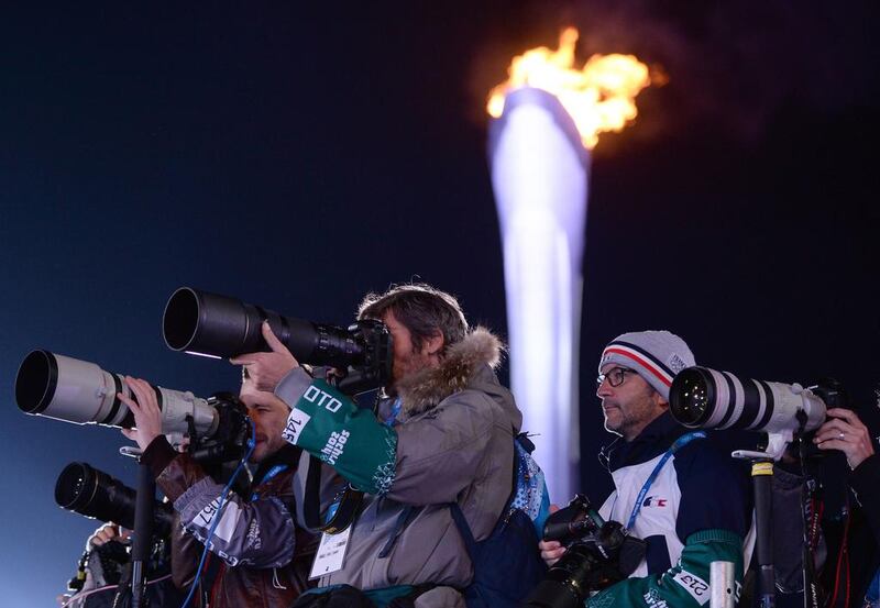 Photographers take pictures during the medal ceremony on Wednesday. Andrej Isakovic / AFP