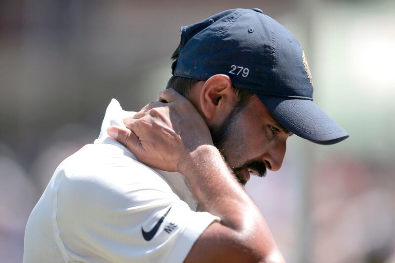 (FILES) In this file photo taken on January 13, 2018 Indian bowler Mohammed Shami leaves the field during the first day of the second Test cricket match between South Africa and India at Supersport cricket ground in Centurion, South Africa. 
India's cricket board has said that it had withheld the renewal of star paceman Mohammad Shami's contract because of "unsavoury" allegations that he cheated on his wife. Shami, who represented India during the tour of South Africa in January, has dismissed the accusations of infidelity as "part of big conspiracy" to defame him.

 / AFP PHOTO / GIANLUIGI GUERCIA