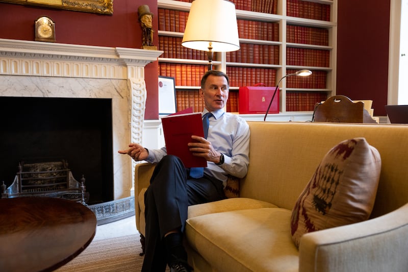 The Chancellor Jeremy Hunt prepares for the spring budget with his team at No11 Downing Street. Zara Farrar / HM Treasury