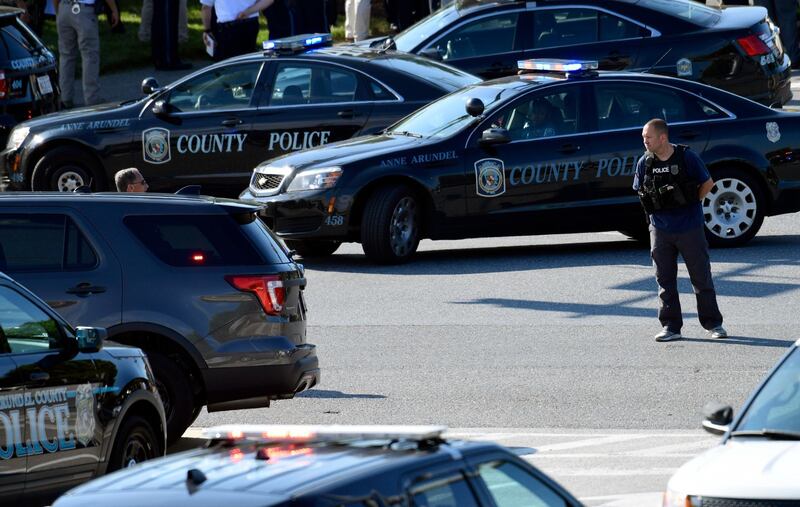 The newsroom looked “like a war zone,” Phil Davis, a Capital Gazette crime reporter who was in the building at the time of the shooting, said in an interview with the Baltimore Sun. Susan Walsh / AP Photo