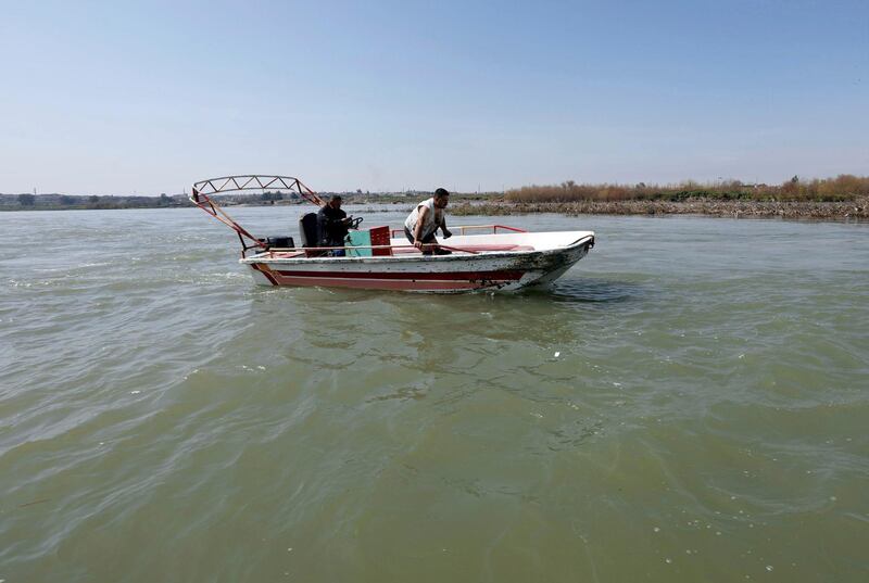 Iraqi rescuers search for victims on the Tigris river. Reuters