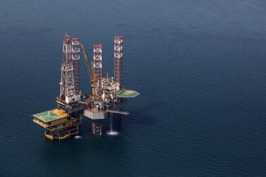 An offshore drilling platform stands in shallow waters at the Manifa offshore oilfield, operated by Saudi Aramco. Bloomberg