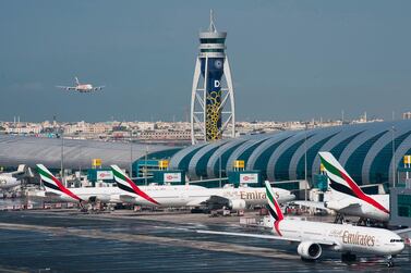An Emirates jetliner comes in for landing at Dubai International Airport. To boost passenger numbers, the airport operator is urging countries to move away from mandatory quarantines on arriving passengers and toward coronavirus testing before departure, followed by mandatory mask-wearing on aircraft. AP.