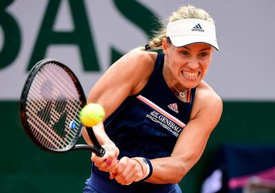 epa06784953 Angelique Kerber of Germany plays Caroline Garcia of France during their women’s round of 16 match during the French Open tennis tournament at Roland Garros in Paris, France, 04 June 2018.  EPA/CAROLINE BLUMBERG