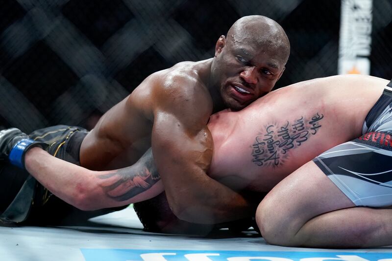 Kamaru Usman grapples with Colby Covington during their welterweight championship bout. AP Photo