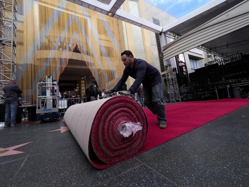 A worker rolls out the red carpet for the 91st Academy Awards take place in Hollywood.. EPA