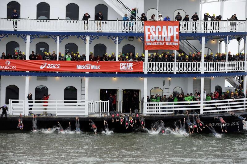 Triathletes dive off a boat at the beginning of the 34th Escape from Alcatraz Triathlon on Sunday in San Francisco, California. Ezra Shaw / Getty Images / AFP / June 1, 2014