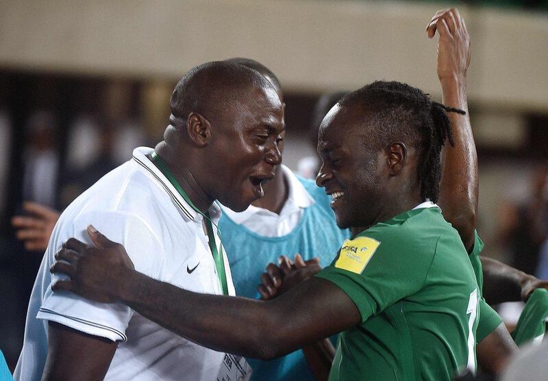 Nigeria's forward Victor Moses, right, celebrates after scoring against Algeria in their 2018 World Cup qualifying match at the Akwa Ibom State Stadium in Uyo on November 12, 2016. Utomi Ekpei / AFP